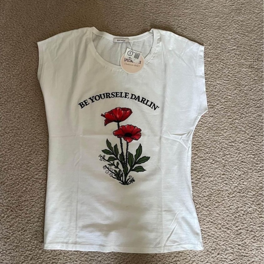 Womans brand new with tags white t-shirt with slogan. Size S